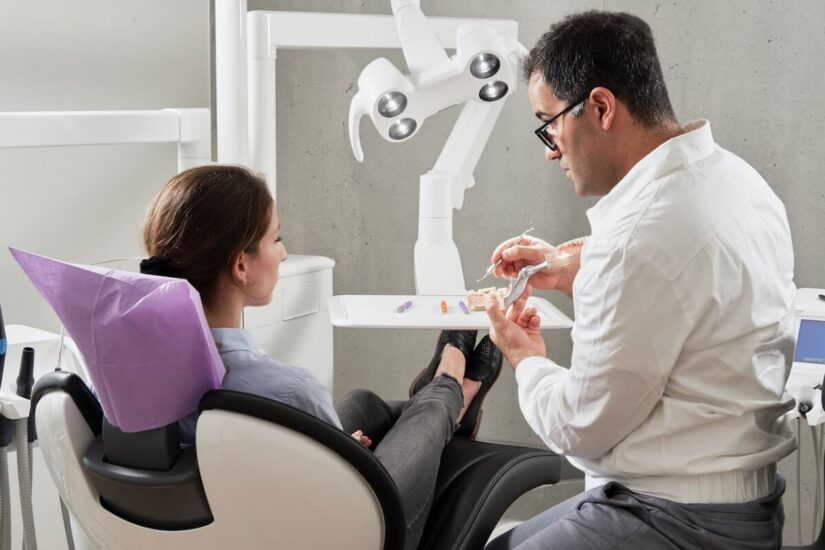 Dentist explaining about dental implants