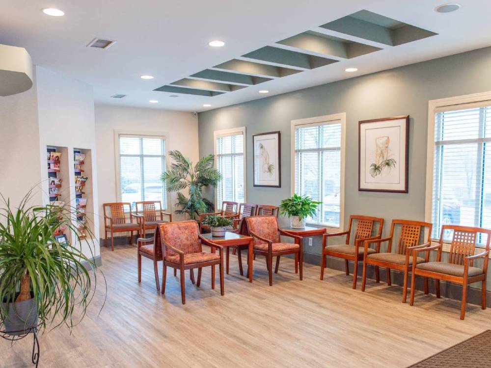 Compartment With Lot Of Chairs And Paitings On The Wall