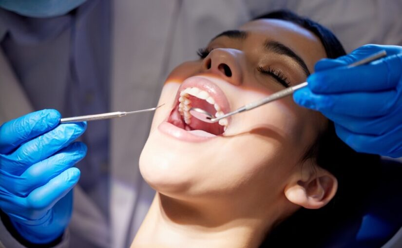 Woman with wide open mouth at dentist